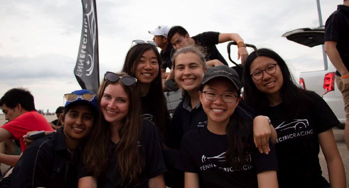 Jin (second from the right) and teammates celebrate together after a competition