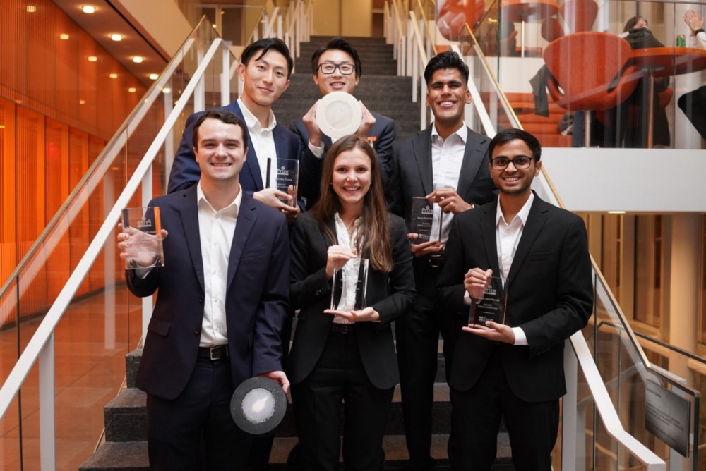 Yumin Gao, Leo Li, Minhal Dhanjy, Darshan Bhosale, Kateryna Kharenko and Ryan Goethals (clockwise from top left) pose with their prototypes and trophies.