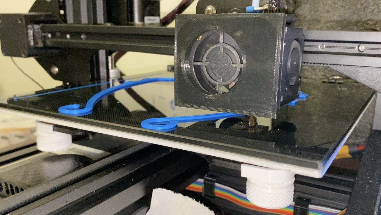 3D printer printing out face shield mounts for PPE