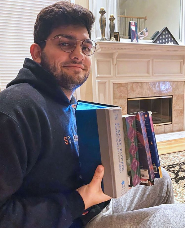 Archit Dhar holds up Harry Potter books 