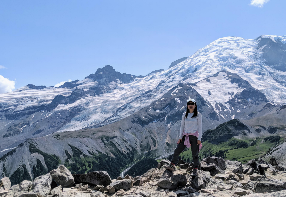 Xunjing Wu posing in front of Mt. Ranier.