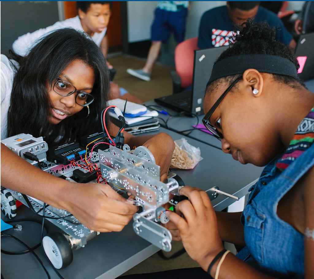 Blended Learning Initiative students working on a robot