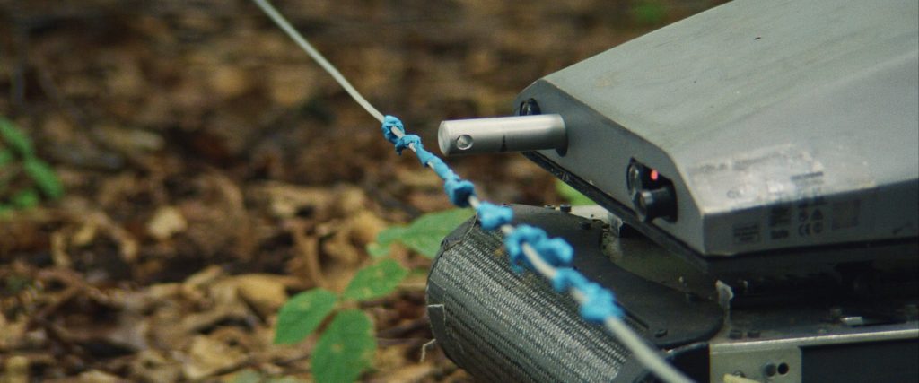 A detail shot from Lapsis, showing an automatic cabler detecting a wire trap.