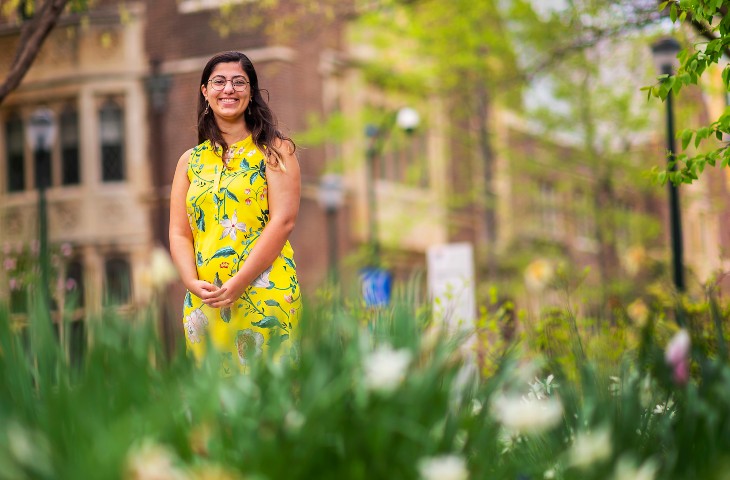 Yasmina Al Ghadban stands in front of the Towne Building