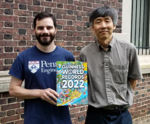 Devin Carrol and Mark Yim pose with the 2022 edition of the Guinness World Records