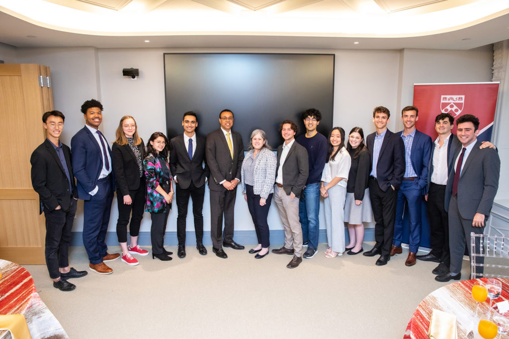 The prize winners pose in a conference room.