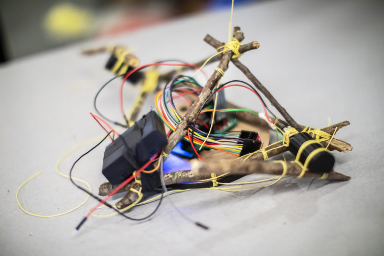 A robot made of lashed-together sticks and wires