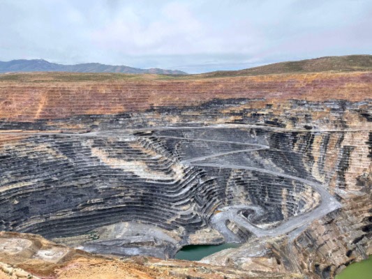Open-pit mines like the one seen here generate millions of tons of waste each year. 