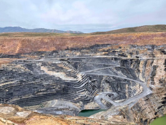 Open-pit mines like the one seen here generate millions of tons of waste each year.