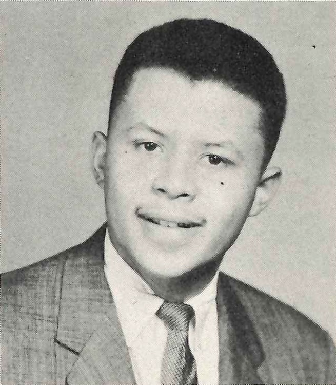 Henry Coshburn wears a suit and tie in his 1957 yearbook photo