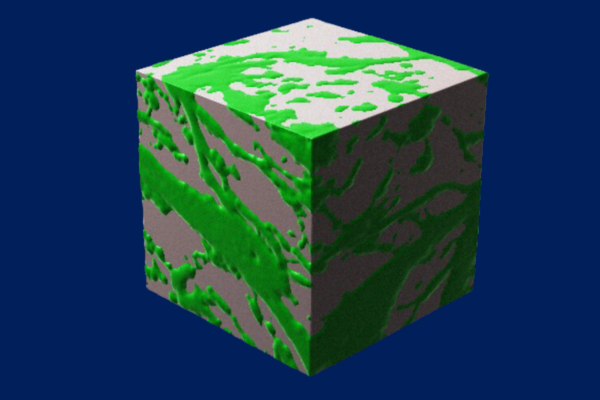 A cube on a blue background. The cube is green and gray, with a mixed pattern, showing what a bicontinuous hydrogel looks like.