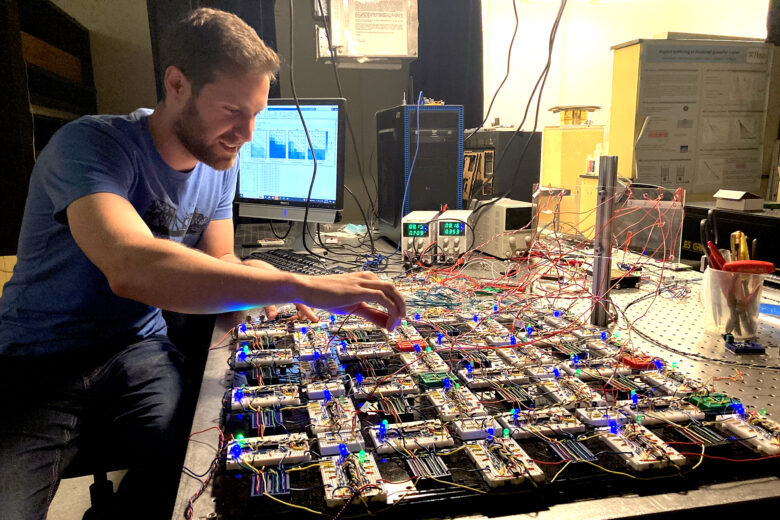 Sam Dillavou, a postdoc in the Durian Research Group in the School of Arts & Sciences, built the components of this contrastive local learning network, an analog system that is fast, low-power, scalable, and able to learn nonlinear tasks. (Image: Erica Moser)