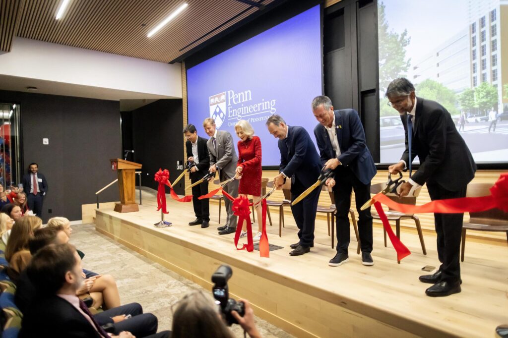 (Left to right) Ramanan Raghavendran, chair of Penn’s Board of Trustees; Interim President J. Larry Jameson; Penn President Emerita Amy Gutmann; trustee Harlan Stone; chair of the Penn Engineering Board of Advisors Rob Stavis; and Penn Engineering’s Nemirovsky Family Dean Vijay Kumar cut a ribbon on Amy Gutmann Hall, the University’s new center for data science and artificial intelligence.