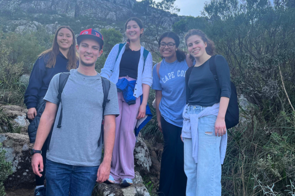 A picture of four students on the side of a mountain in Montevideo, Uruguay.